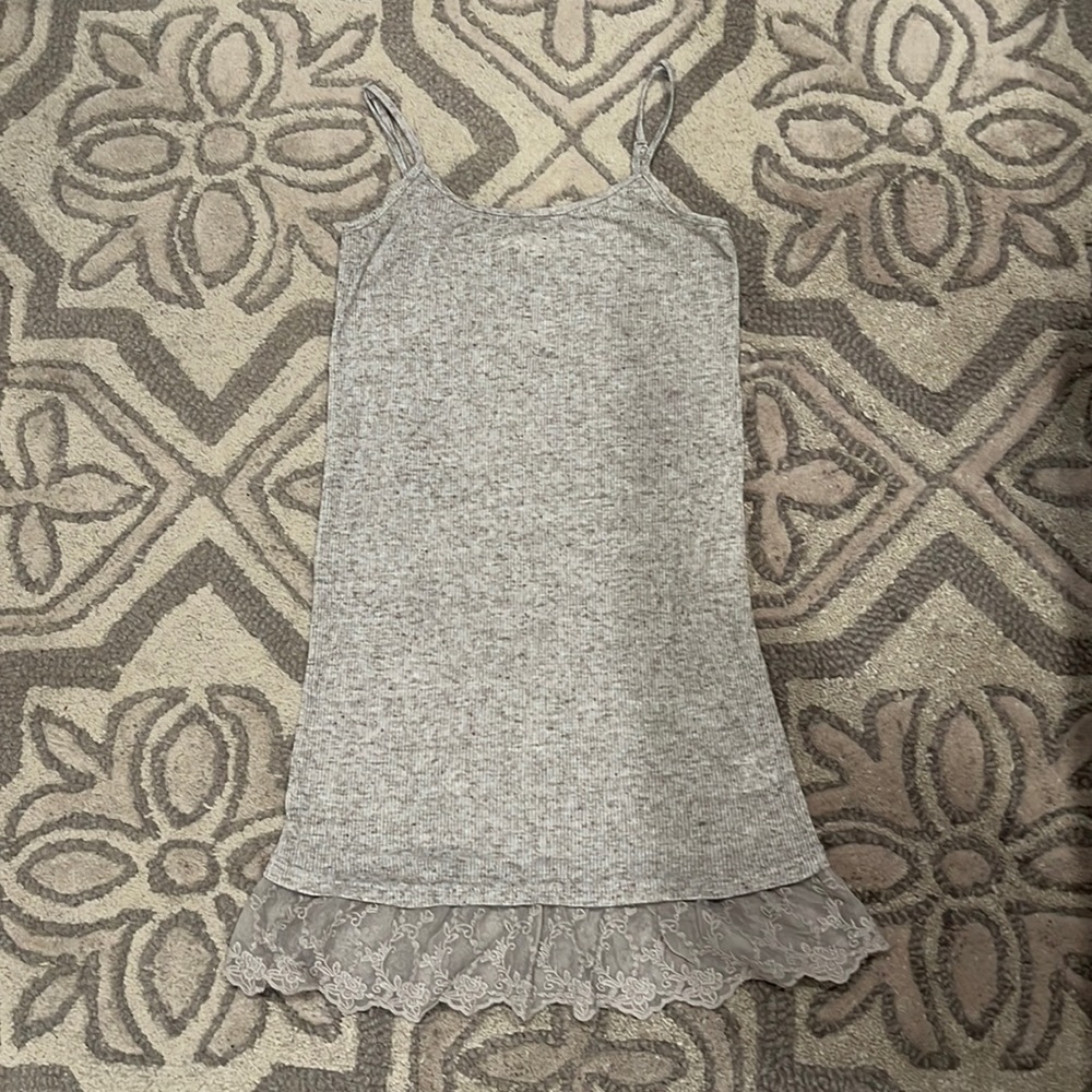 Gray tank top with lace detail.